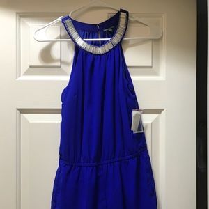 Blue romper with a beaded neckline!
